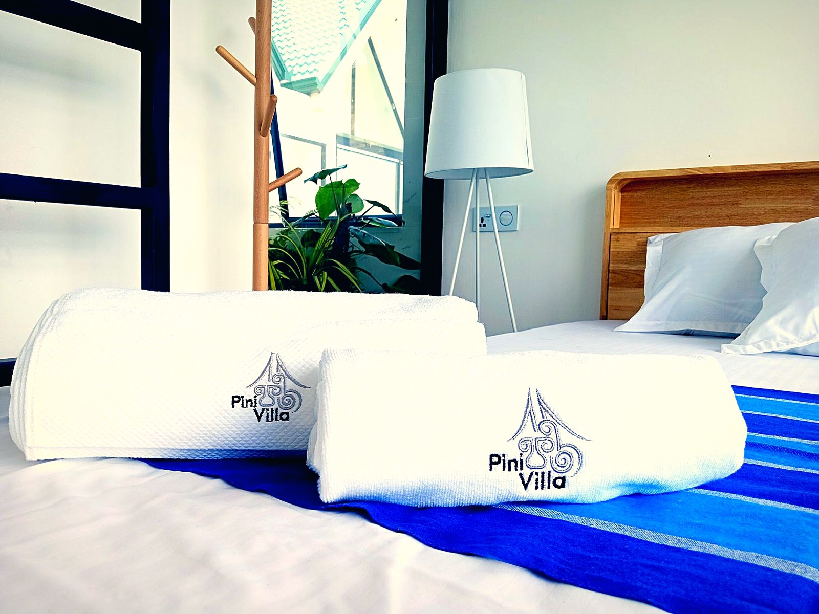 Bright room with white bedding and blue accents