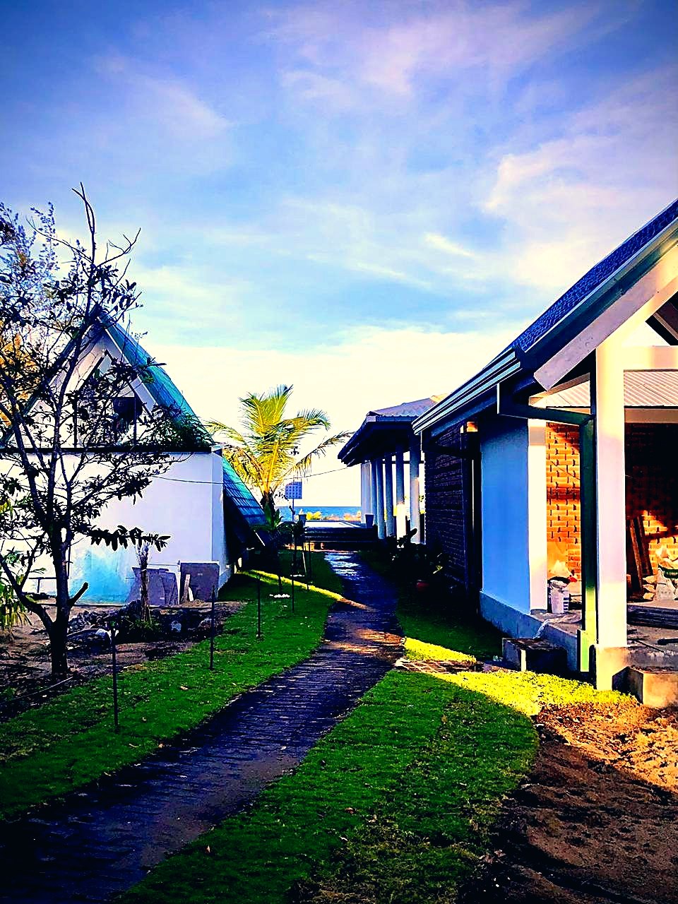 A-frame villa framed by palms